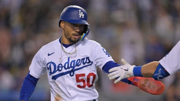 Jun 3, 2022; Los Angeles, California, USA; Los Angeles Dodgers right fielder Mookie Betts (50) celebrates after scoring on a RBI single by shortstop Trea Turner (not pictured) in the seventh inning against the New York Mets at Dodger Stadium. Mandatory Credit: Jayne Kamin-Oncea-USA TODAY Sports